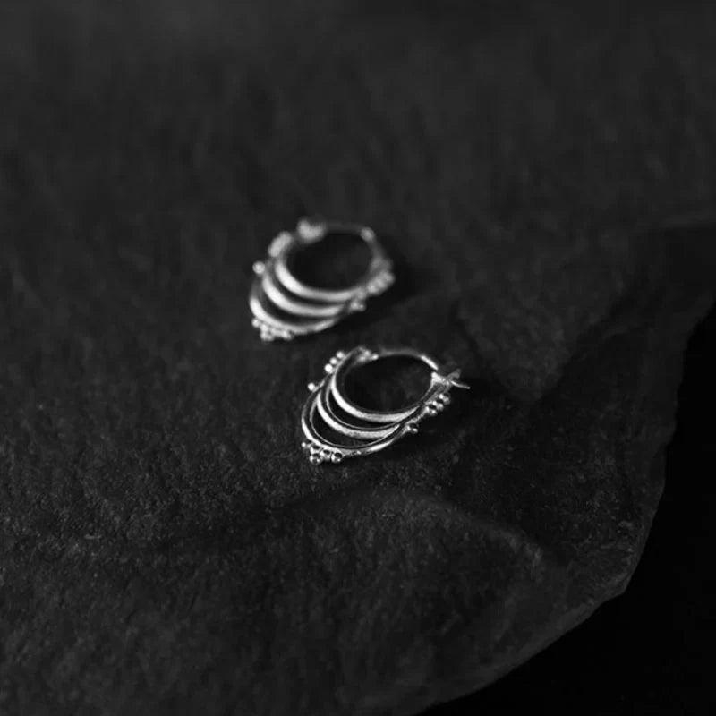 925 sterling silver beaded hoop earrings with granulation detail on the band, photographed to show hoop diameter and surface texture.