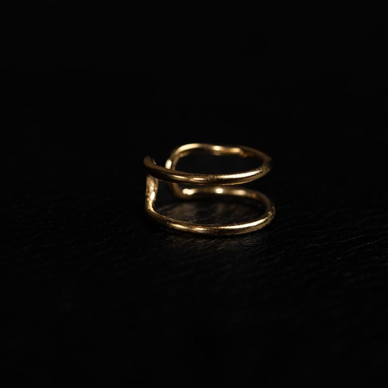 Gold vermeil double-wrap ear cuff earrings with no piercing required, handcrafted by Noir KĀLA.