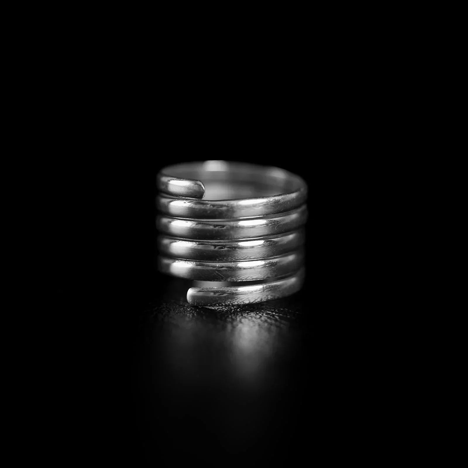 925 sterling silver stacked spiral ring with overlapping continuous bands, demonstrating width and layering depth for ring stacking