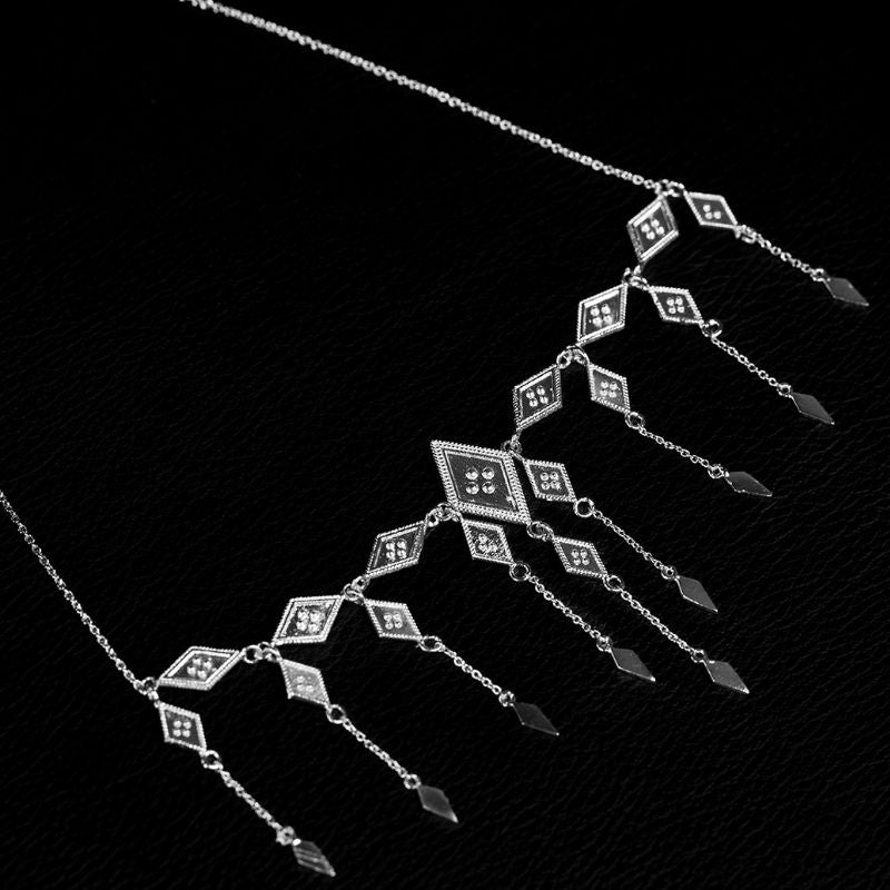 925 sterling silver collar of linked diamond-shaped granulated panels around a larger central motif, curved to the neck.